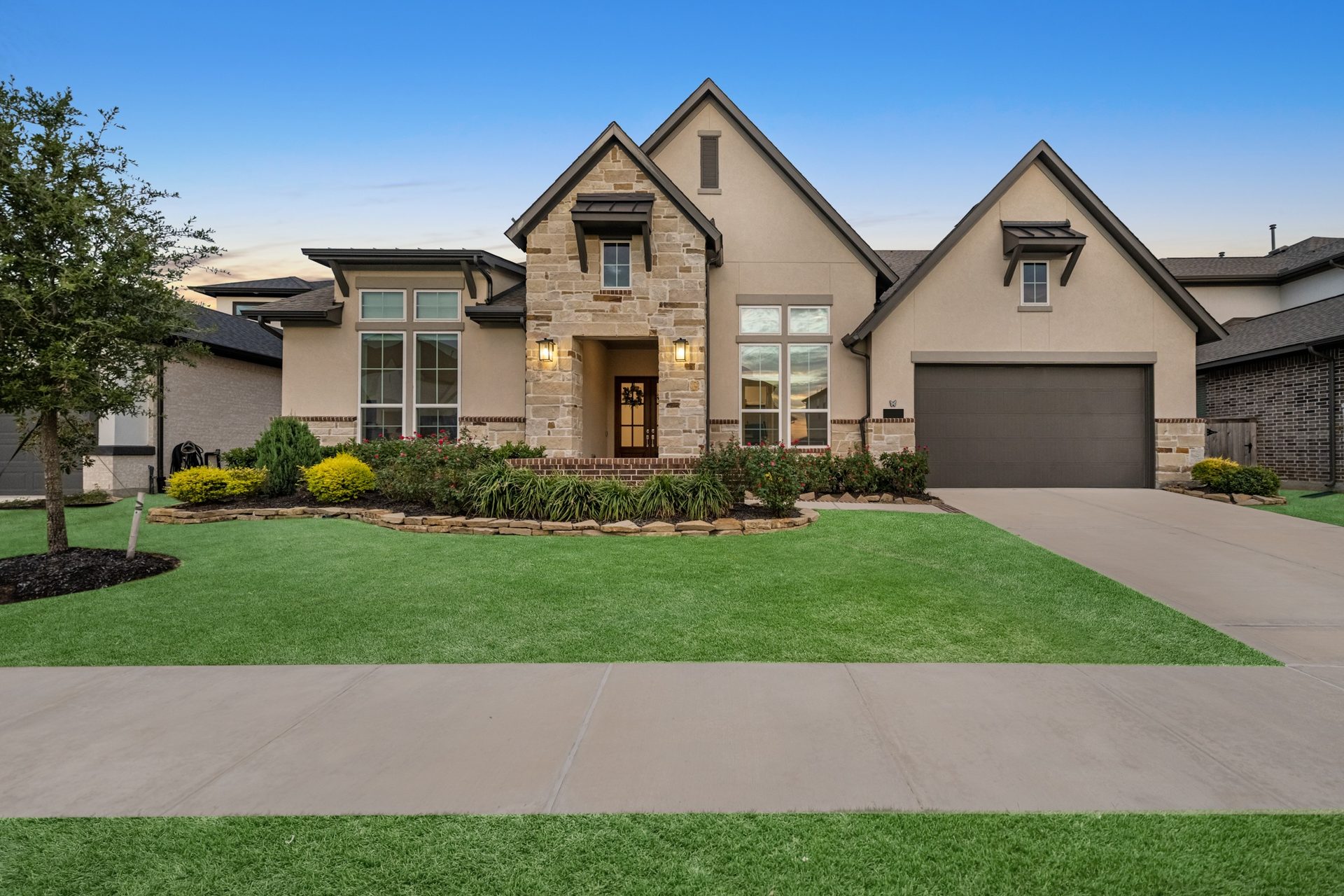Before: daytime exterior of a stone-front home