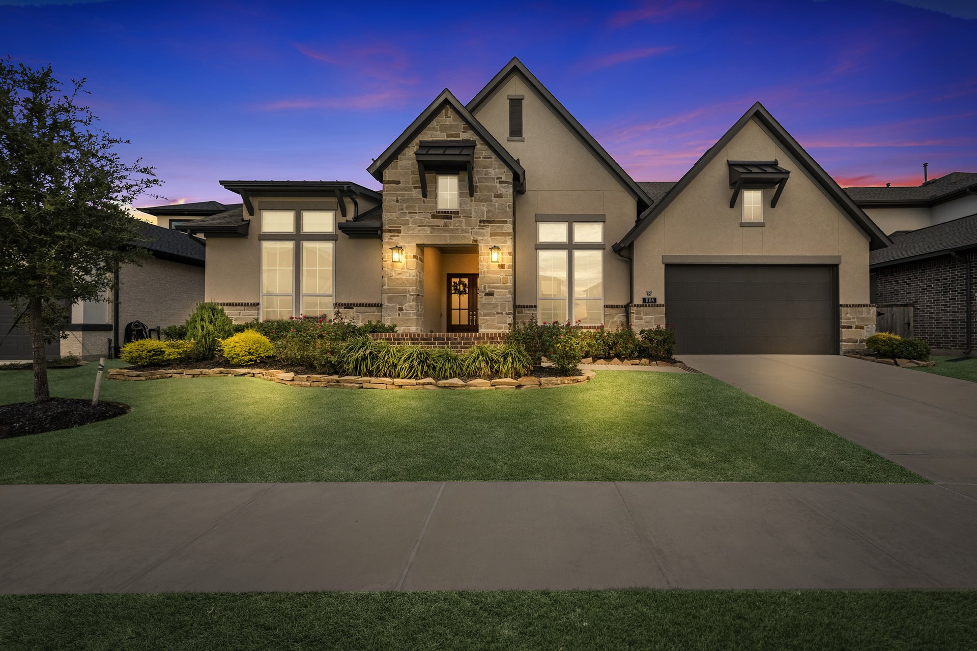 After: virtual twilight of the same stone-front home