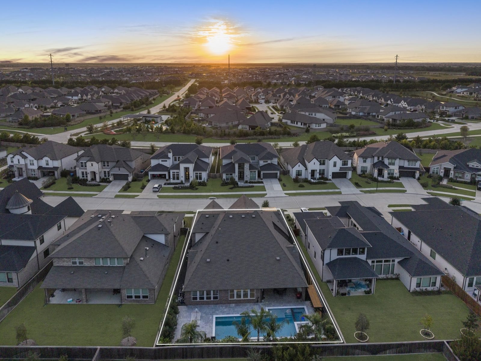 Aerial of a neighborhood lot with property lines drawn