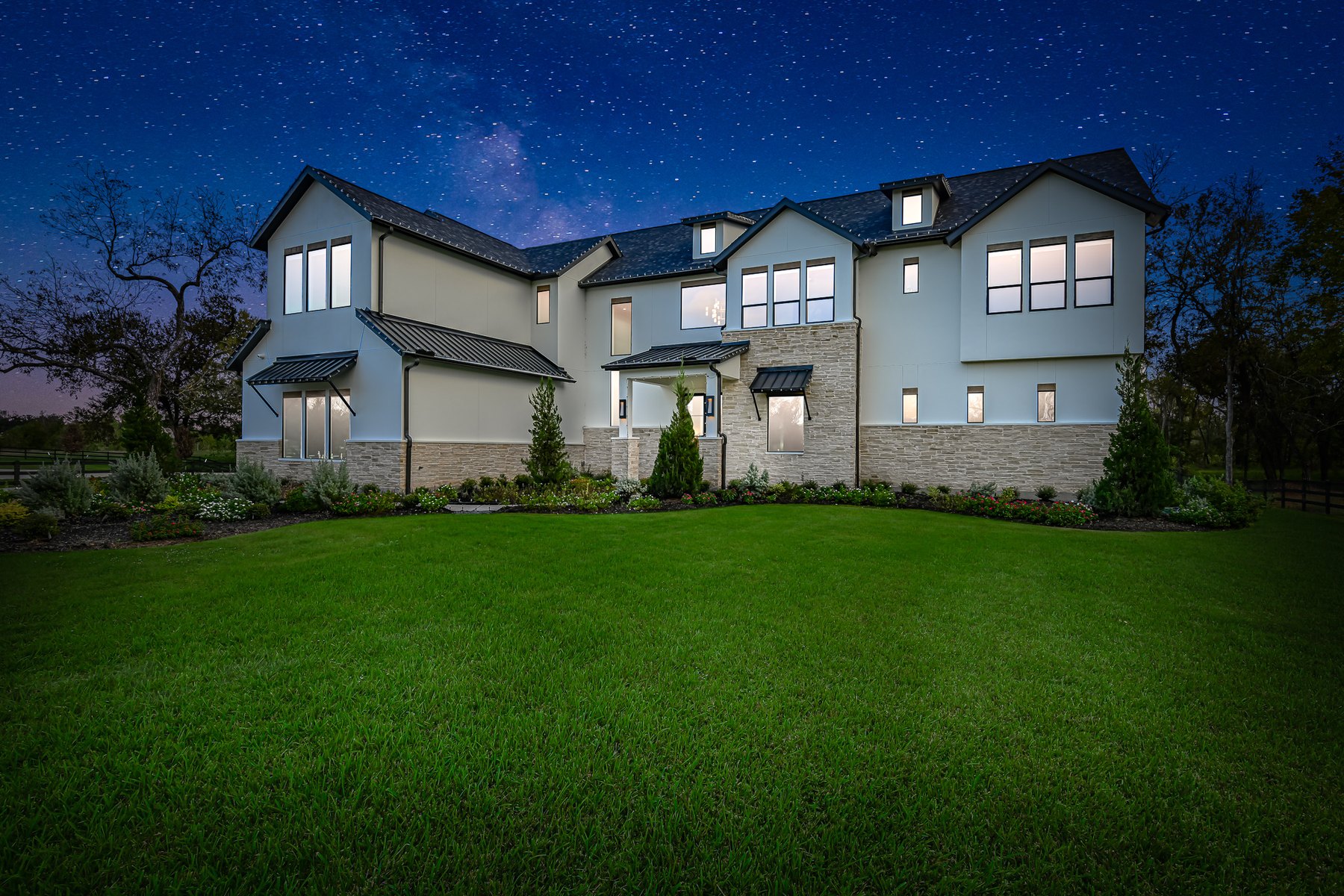 Virtual twilight of a two-story home under a starry sky